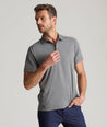 Model is wearing UNTUCKit Clavidor polo in gray.