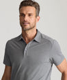 Model is wearing UNTUCKit Clavidor polo in gray.