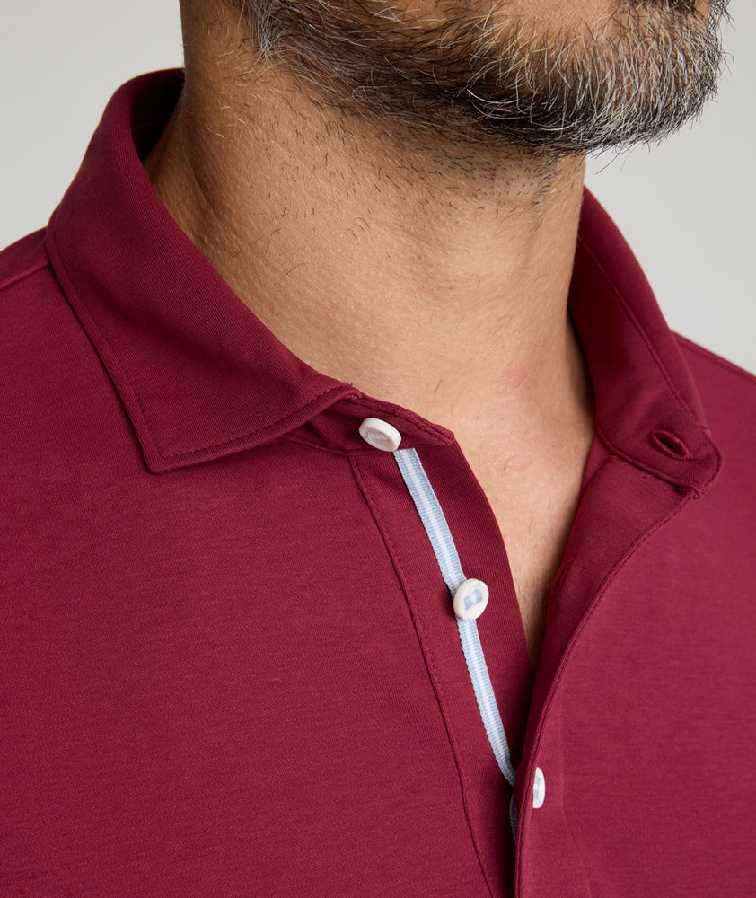 Model is wearing UNTUCKit Long Sleeve Damaschino in Rhododendron Red.