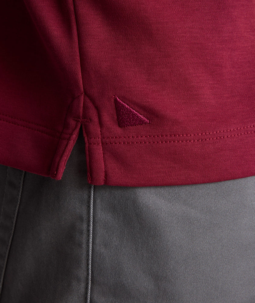 Model is wearing UNTUCKit Long Sleeve Damaschino in Rhododendron Red.