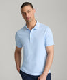Model is wearing UNTUCKit Day Performance Polo in Placid Blue.