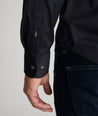 Model is wearing UNTUCKit gironde shirt in black.