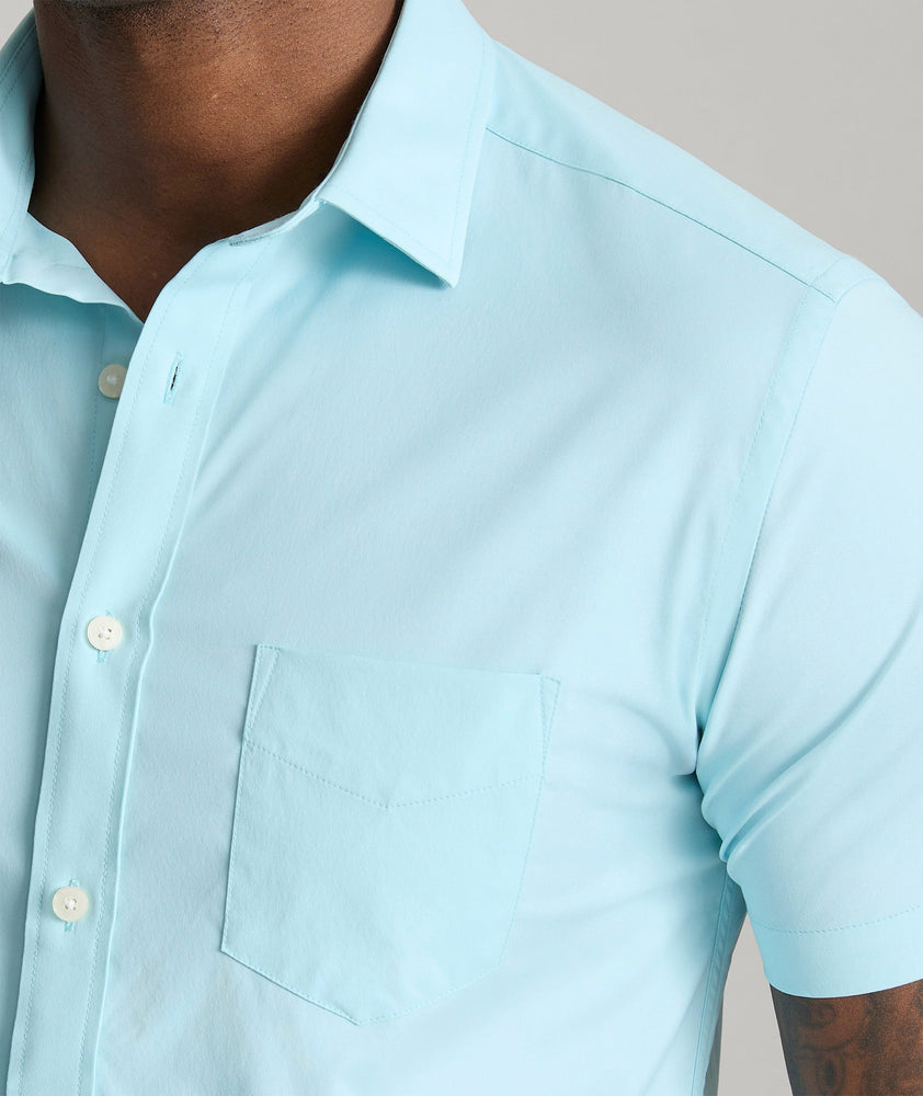 Model is wearing UNTUCKit gironde shirt in corydalis blue.