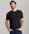Model is wearing UNTUCKit glera tencel solid black henley.