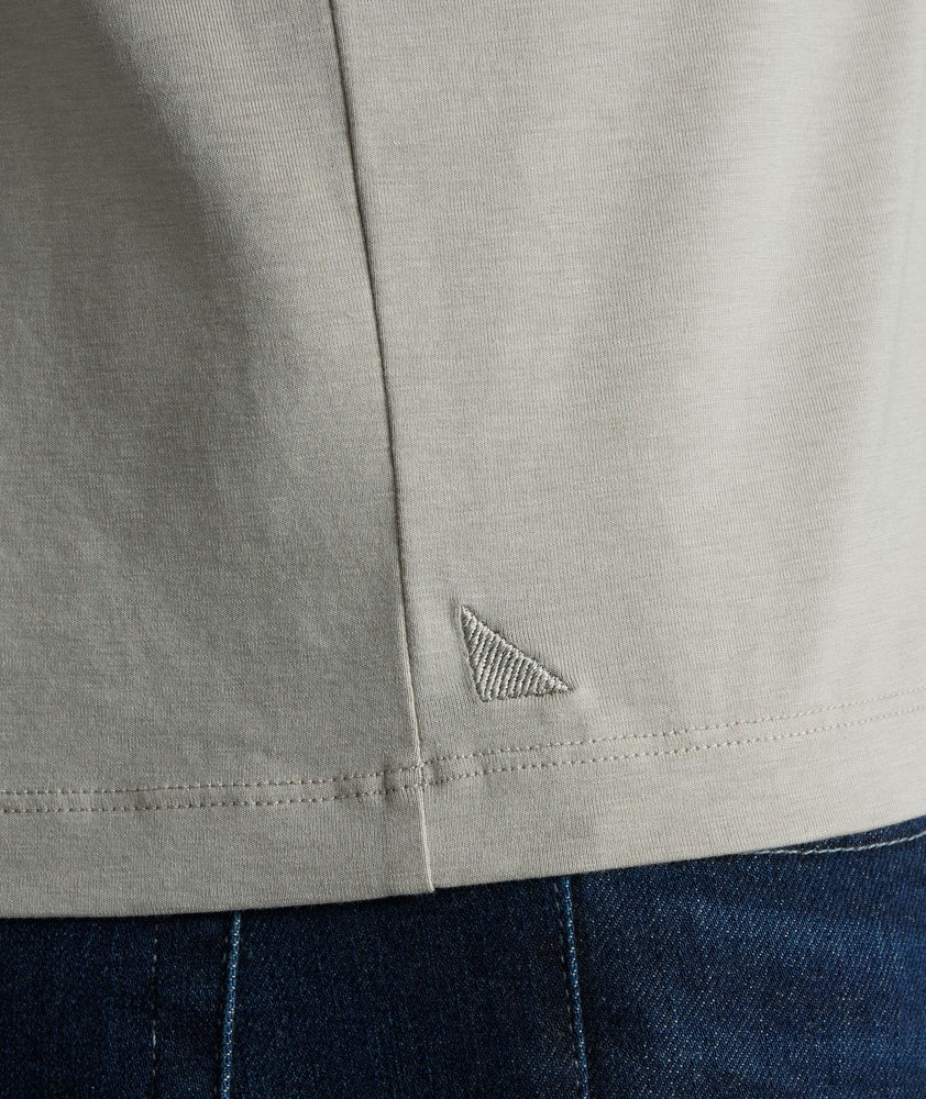 Model wearing an UNTUCKit Military Green Essential Henley in EcoSoft™.