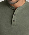 Model is wearing UNTUCKit Harrow Herringbone Henley in Beetle.