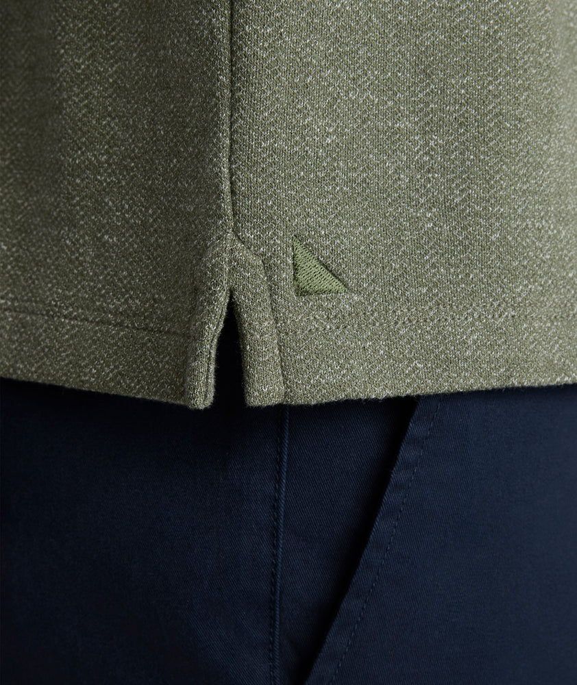 Model is wearing UNTUCKit Harrow Herringbone Henley in Beetle.