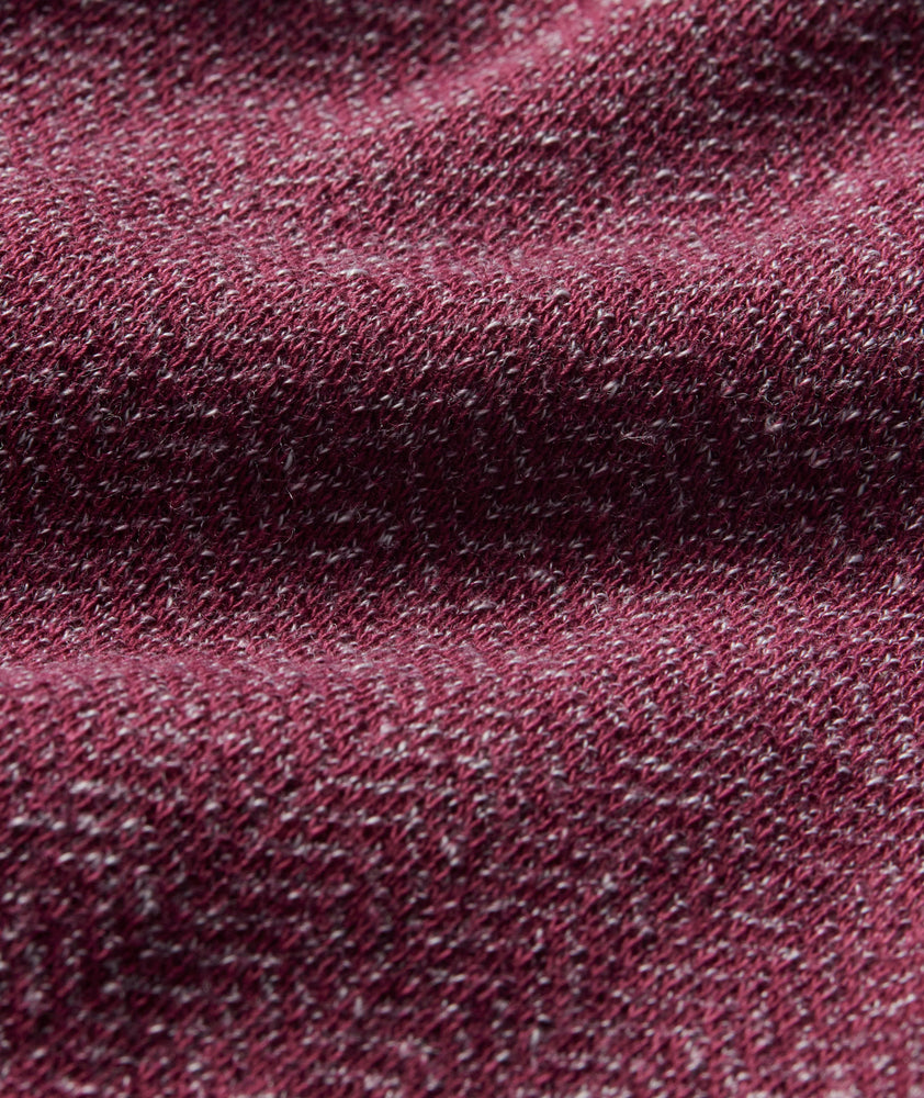 Model is wearing UNTUCKit Harrow Herringbone Henley in Tawny Port.