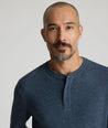 Model is wearing UNTUCKit Harrow Herringbone Henley in Navy.