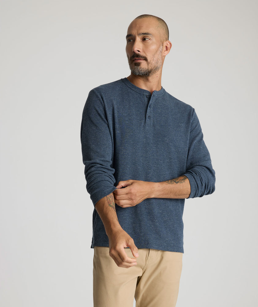 Model is wearing UNTUCKit Harrow Herringbone Henley in Navy.
