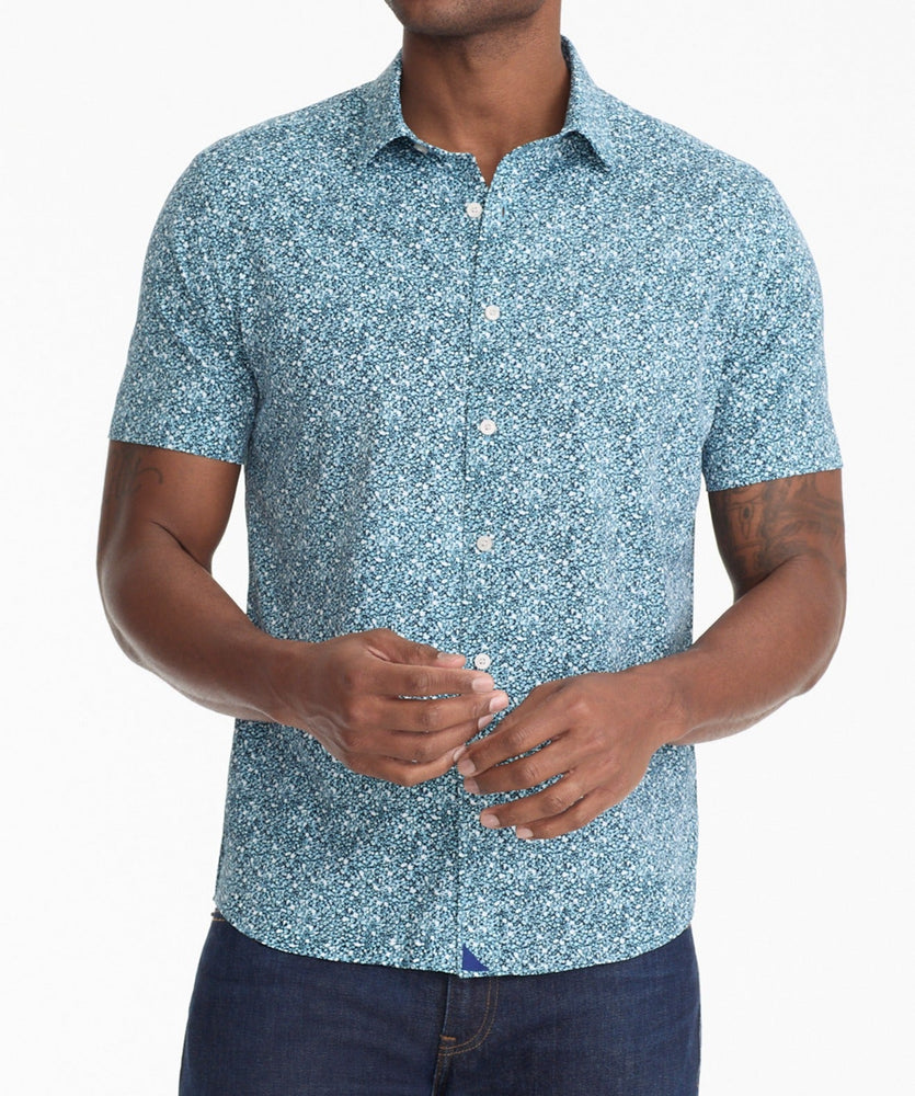 Model is wearing UNTUCKit James shirt in blue.
