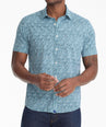 Model is wearing UNTUCKit James shirt in blue.