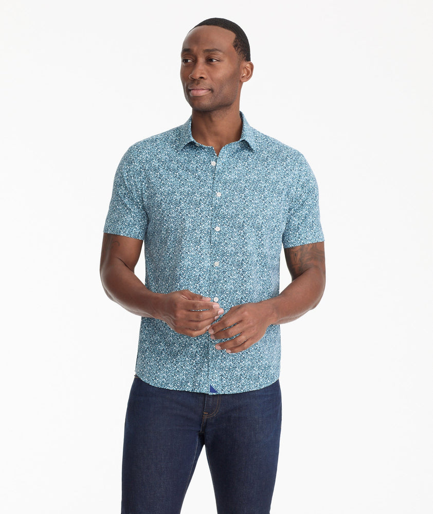 Model is wearing UNTUCKit James shirt in blue.