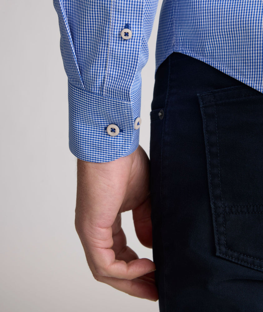 Model is wearing UNTUCKit Kelly wrinkle free shirt in blue gingham.
