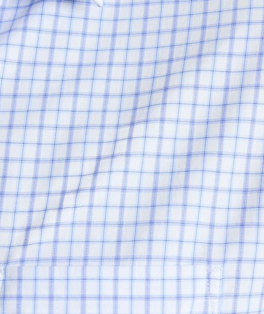 Model is wearing UNTUCKIt northcliffe performance check shirt in purple.