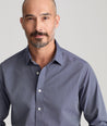 Model is wearing UNTUCKit wrinkle free orville shirt.