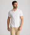 Model is wearing UNTUCKit Rockwell short sleeve cotton shirt.