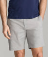 Model is wearing UNTUCKit gray 9" chino shorts.