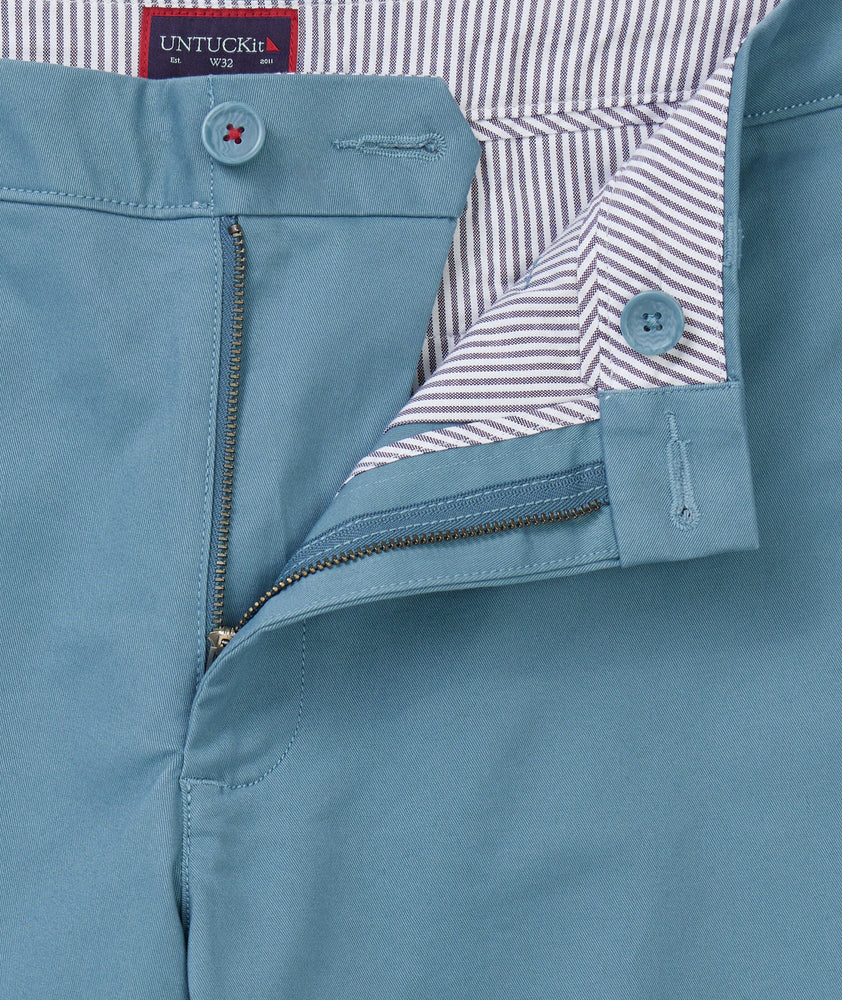 Model is wearing UNTUCKit st.vincent shorts in mid blue.