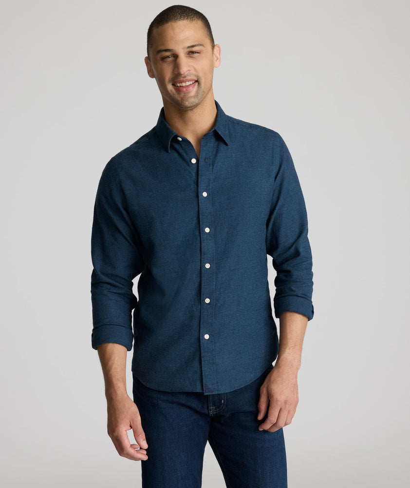 Model is wearing UNTUCKit Veneto shirt in teal.
