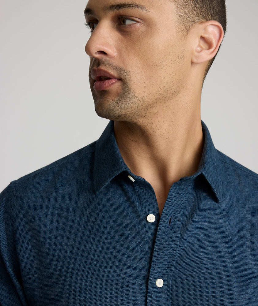 Model is wearing UNTUCKit Veneto shirt in teal.