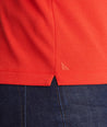 Model wearing a Red Traveler Polo with COOLMAX®