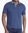 Model wearing a Blue Printed Polo with Contrast Collar