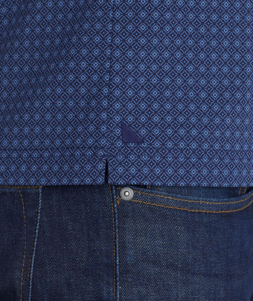 Model wearing a Blue Printed Polo with Contrast Collar