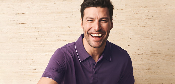 Man wearing UNTUCKit Polo holding a golf club