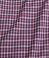 Model is wearing UNTUCKit performance Delune shirt in red. 