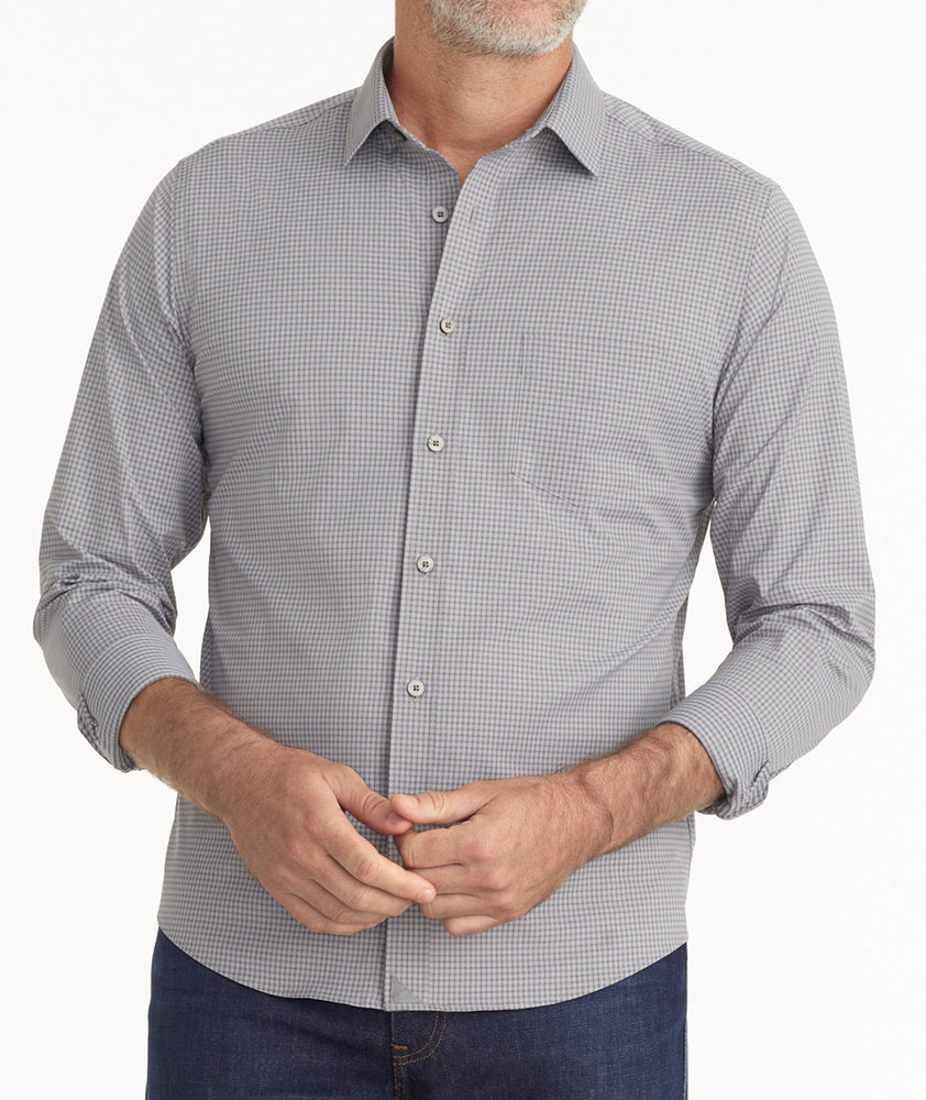 Model is wearing UNTUKit Wrinkle-Free Performance Apremont Shirt in Gray Grounded Maroon Check.