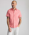 Model is wearing UNTUCKit Performance Short-Sleeve Arundel Shirt in Red Crab Print.