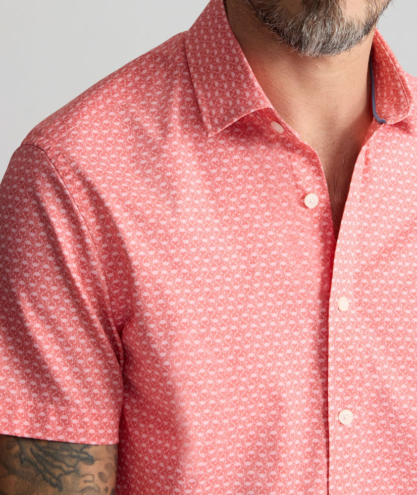 Model is wearing UNTUCKit Performance Short-Sleeve Arundel Shirt in Red Crab Print.