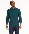 Model is wearing UNTUCKit Flannel Barrelstone Shirt in Blue & Green Check.