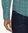 Model is wearing UNTUCKit Wrinkle-Free Performance Flannel Bergstrom Shirt in Green Gingham.