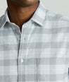 Model is wearing UNTUCKit Performance Flannel Brightlake Shirt in gray.