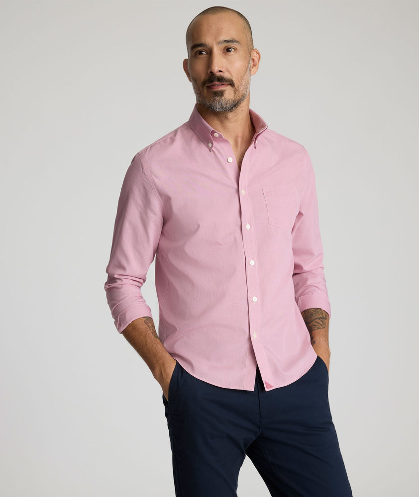 Model is wearing UNTUCKit Cadetto wrinkle-free shirt in rose wine. 
