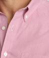 Model is wearing UNTUCKit Cadetto wrinkle-free shirt in rose wine. 