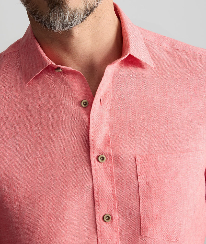 Model is wearing UNTUCKit Cameron Shirt in cayenne. 