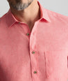 Model is wearing UNTUCKit Cameron Shirt in cayenne. 
