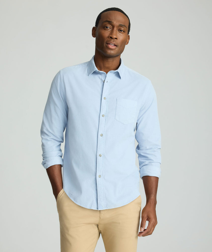 Model is wearing UNTUCKit Cord Shirt in heather blue. 