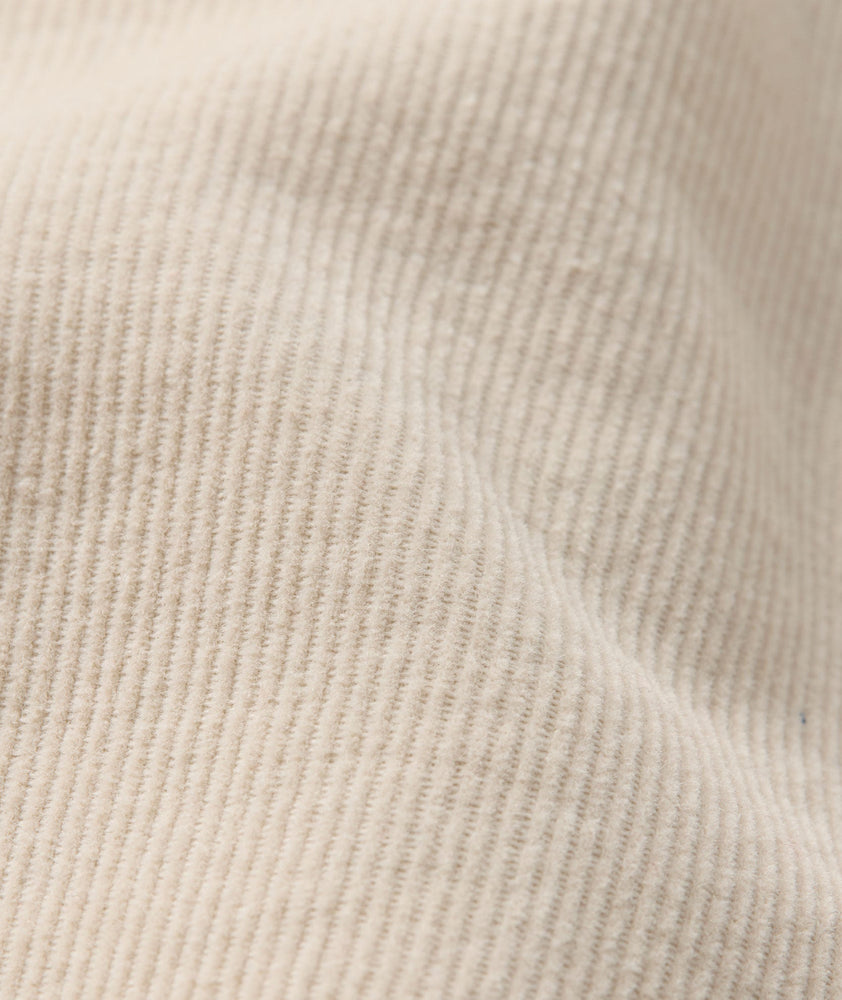 Model is wearing UNTUCKit Cord Shirt in fog. 