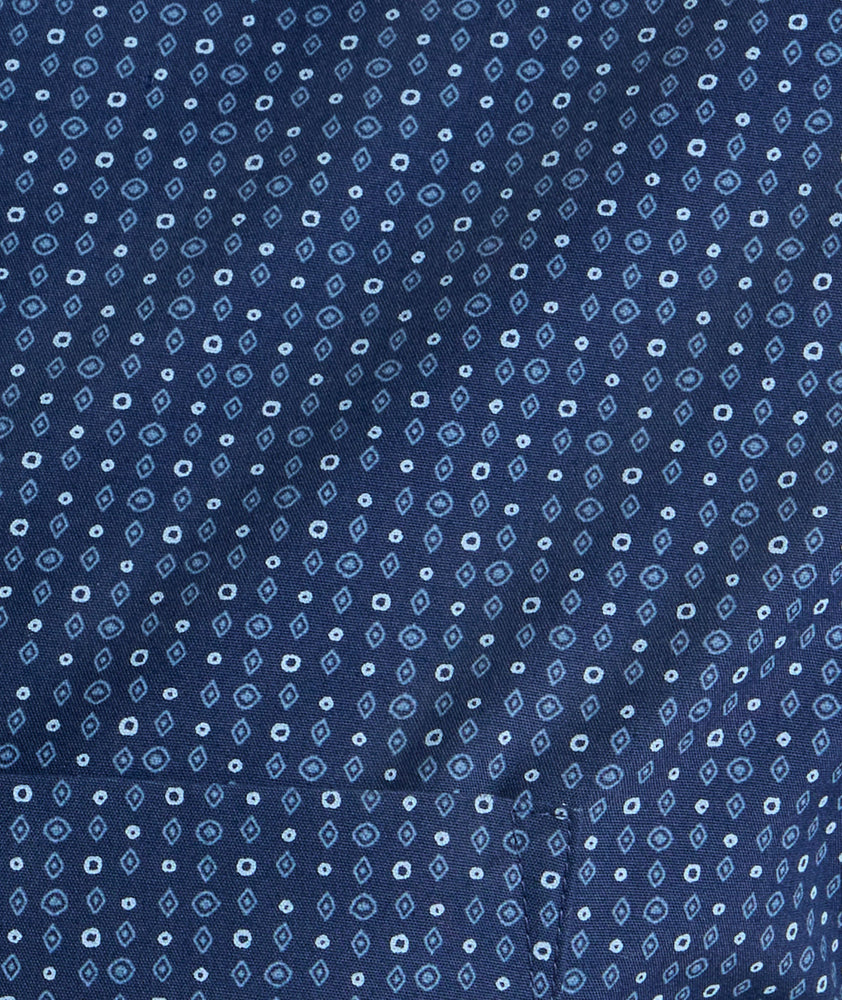 Model is wearing UNTUCKit Wrinkle-Free Cascadar Shirt in navy. 