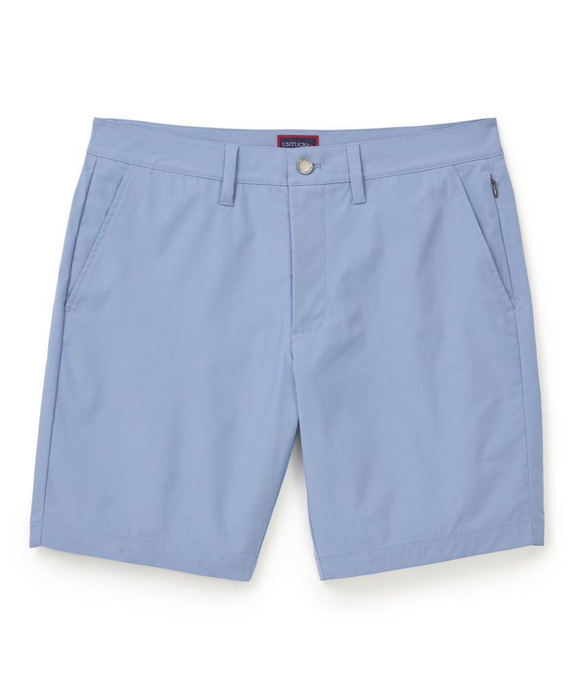 Model is wearing UNTUCKit Chancellor shorts in stonewash.