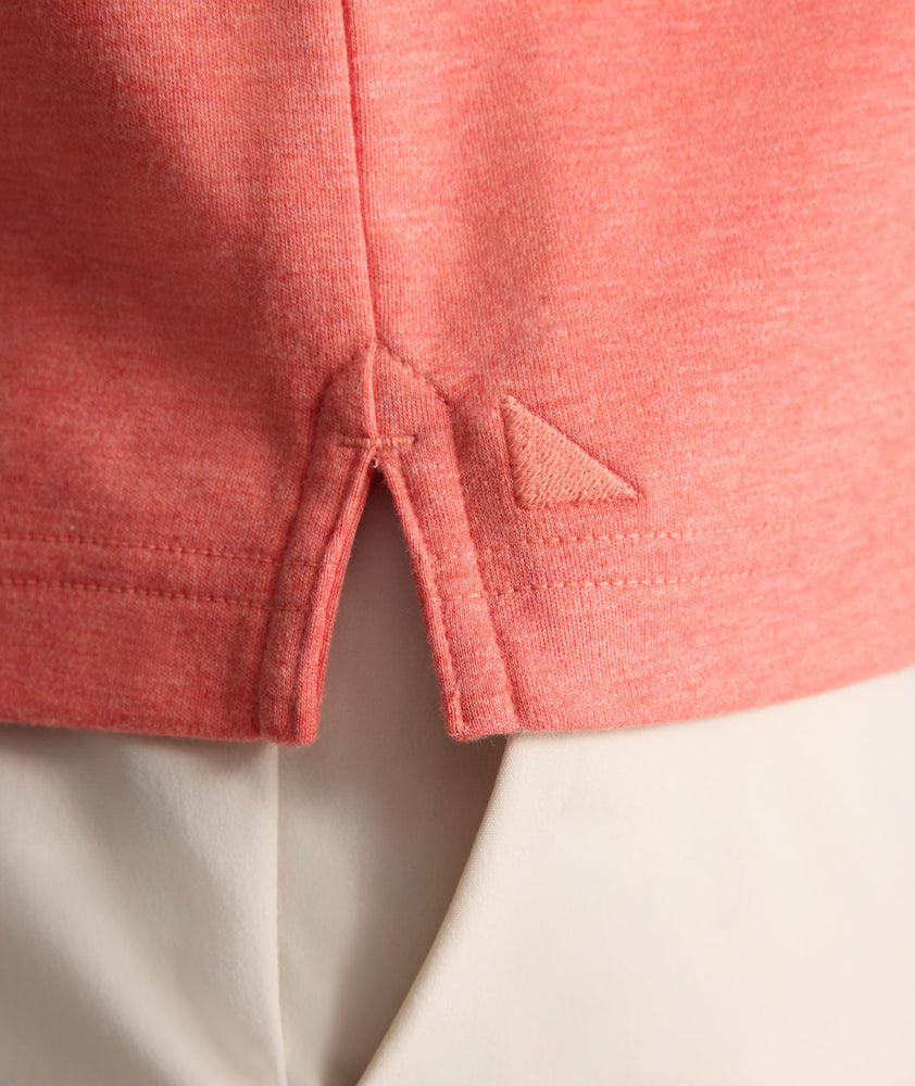 Model is wearing UNTUCKit Wrinkle-Free Damaschino Polo in Heather Coral.