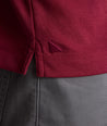 Model is wearing UNTUCKit Long Sleeve Damaschino in Rhododendron Red.