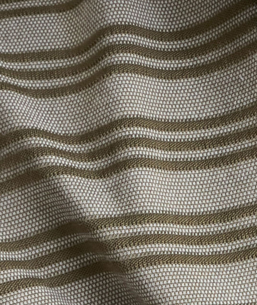 Model is wearing UNTUCKit Performance Hybrid Polo in dark green. 