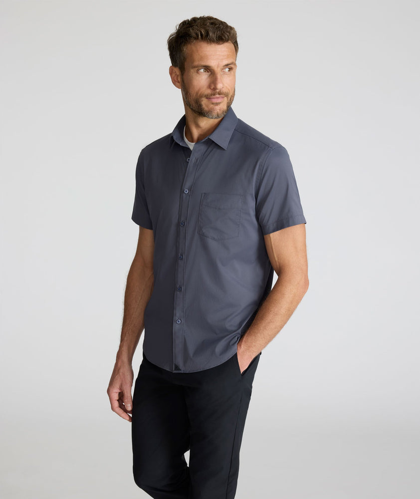 Model is wearing UNTUCKit Performance Short-Sleeve Grionde Shirt.