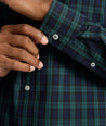 Model is wearing UNTUCKit Wrinkle-Free Grant Shirt in  Green & Navy Tartan.