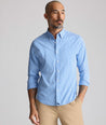 Model is wearing UNTUCKit CottonTek Harland Shirt in blue. 